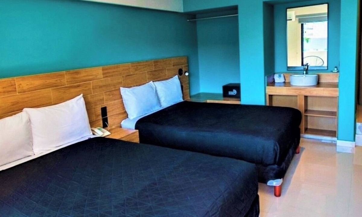 Zona Dorada Hotel | Bright Coastal Deluxe Room Perfect for Relaxing Getaways Near the Shore