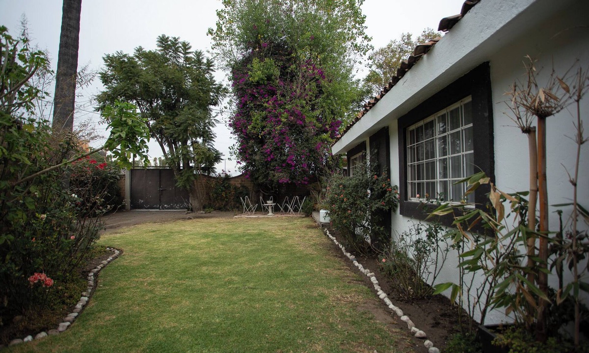 Cholula House | House with garden in front of the Pyramid of Cholula, Puebla,MX
