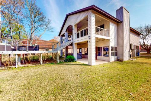 McQueeney House | Lakefront home with hot tub, dock, kayaks, central AC, & great lake views