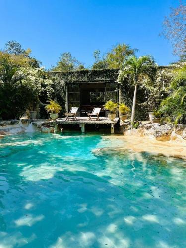 Francisco Uh May Villa | Luxury Jungle villa with cenote pool near Tulum