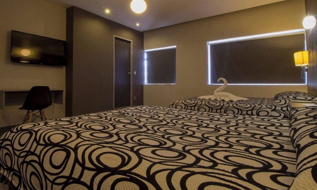 Centro Hotel | Three Modern and Vibrant Rooms Just Minutes from Attractions, Shops, and Dining