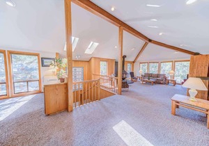 Spacious, unique reverse-living home w/ private deck+hot tub. FREE pool/water pa