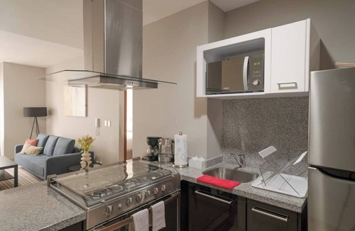 Ampliacion Granada Condo | 1BR|1BA Apartment W/pool, gym, high speed WiFi, located just a 3-minute walk from the new U.S. Embassy