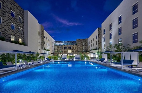 Cancun Hotel | 3 Modern Suite Near CUN Airport | Kitchenette, Pool & Free Breakfast