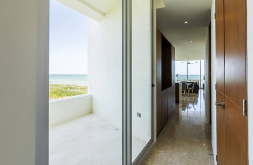 Miramar Apartment | Beachfront apartment with private balcony, heated pool & stunning views