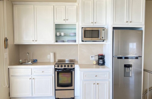 Miramar Condo | Beachfront Penthouse with Large Private Rooftop Patio with Wood Burning Firepit