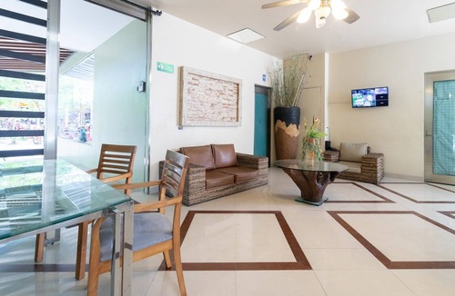 Gonzalo Guerrero Condo | Bright Modern Condo with balcony overlooking 5th Ave. 4 minute walk to the beach