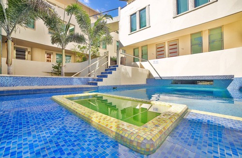 Gonzalo Guerrero Condo | Bright Modern Condo with balcony overlooking 5th Ave. 4 minute walk to the beach