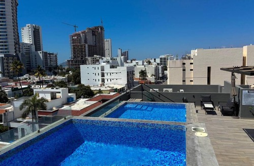 Ferrocarrilera Apartment | Cerca de la Playa con Alberca en Roof By GPSRenta