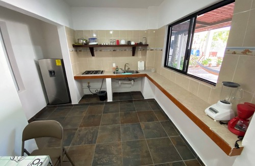 Los Ayala House | Costa Ayala suite 2 with 2 dbl bed and 3 sofas, all basics, 2 blocks from beach
