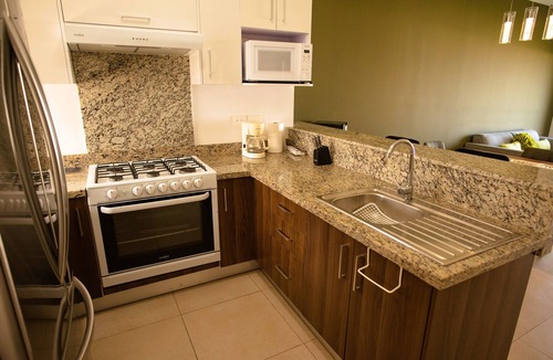 Zona Industrial Condo | Cozy, elegant 2BR steps to US Consulate