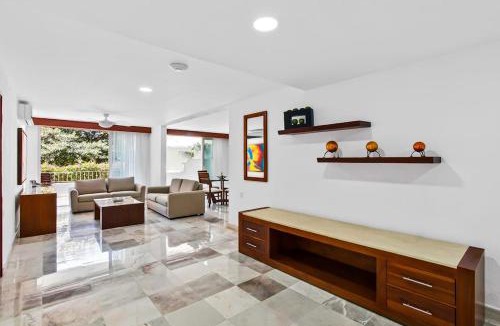 Conchas Chinas House | Elegant suite with ocean-view pools, hot tub, gym, balcony & full kitchen
