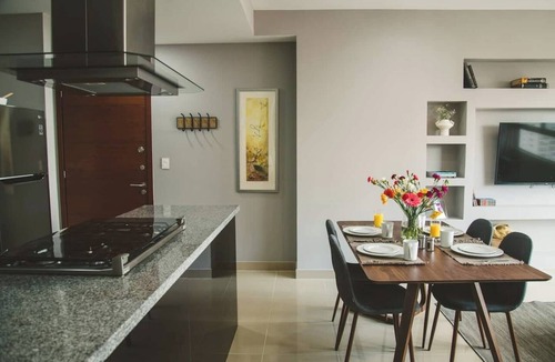 Ampliacion Granada Condo | Fully equipped kitchen, high-speed internet, comfy king-size and queen-size beds, and two TVs, GYM, Pool and located just a 3-minute walk from the new U.S. Embassy