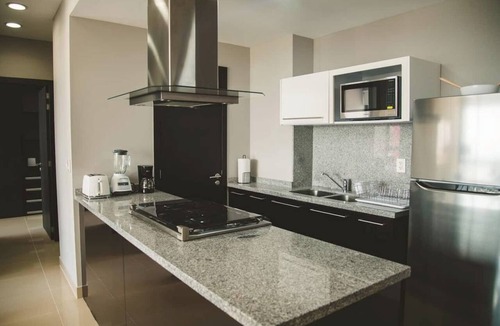 Ampliacion Granada Condo | Fully equipped kitchen, high-speed internet, comfy king-size and queen-size beds, and two TVs, GYM, Pool and located just a 3-minute walk from the new U.S. Embassy