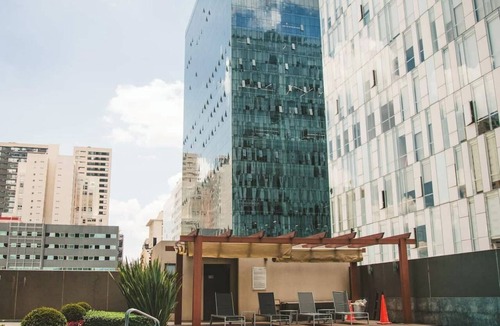 Ampliacion Granada Condo | Fully equipped kitchen, high-speed internet, comfy king-size and queen-size beds, and two TVs, GYM, Pool and located just a 3-minute walk from the new U.S. Embassy