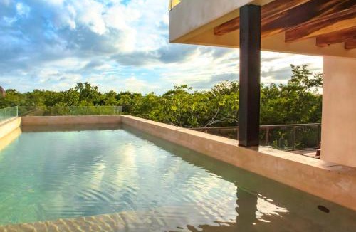 Chemuyil Apartment | Jungle Loft Suite with Terrace & Natural Light - Santuario Hotel Boutique
