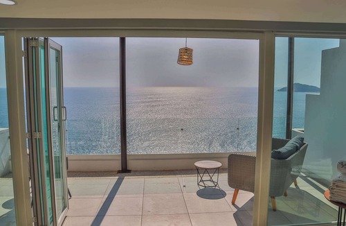 Brisas del Marques Condo | Magical sunsets, king bed, and pro service B403