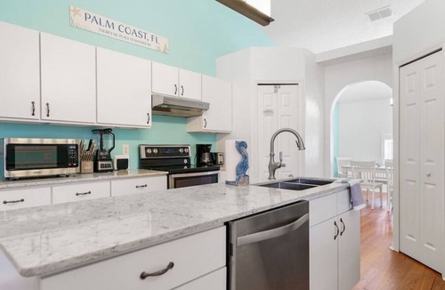 Palm Coast House | Pelican Palm - Poolside summer escape!