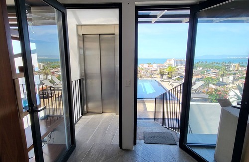Colonia 5 de Diciembre Condo | Penthouse Condo with Private Rooftop Terrace. Short walk to the Beach & Malecón.