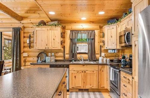 Lyndon Station House | Riverfront cabin with a dock, kayaks and a canoe - firepit and water views