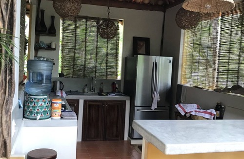 Zihuatanejo House | Romantic bungalow surrounded by trees.