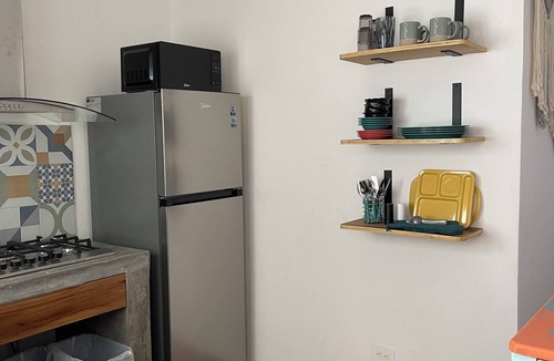 Emiliano Zapata Condo | Romantic zona jr king bed suite, kitchen, balcony, a/c, smart tv, 8 blocks beach