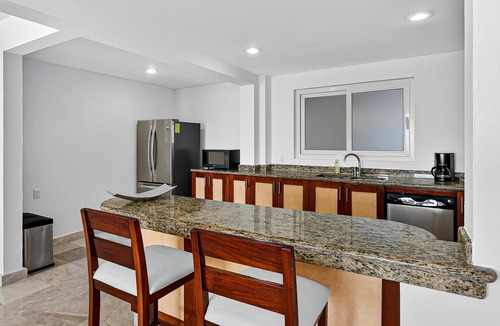 Conchas Chinas Apartment | Stylish oceanview suite with infinity pool, full kitchen & bay-view terrace