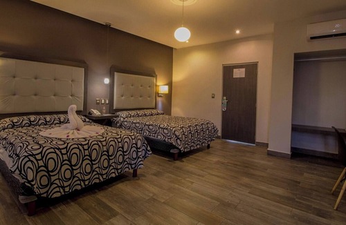 Centro Hotel | Three Modern and Vibrant Rooms Just Minutes from Attractions, Shops, and Dining