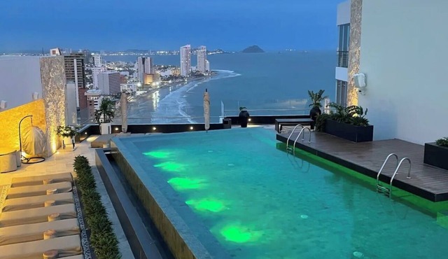2-bedroom condo in serene Mazatlán with AC, fitness room. Live it up