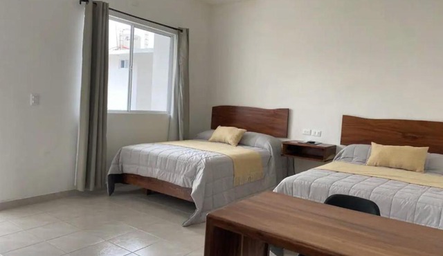 Avenida Suites