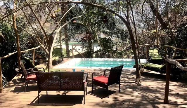 Beachfront tree cabin with deck pool