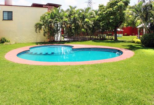 Casa Palmera con Aire acondicionado Alberca Wifi cocina y TV