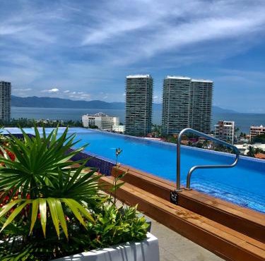 Chic 1BR 1BA Zoho Skies condo with rooftop pool stunning views