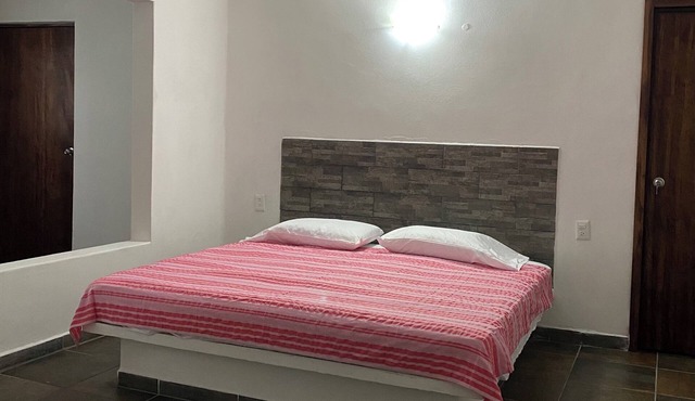 Costa Ayala suite 3 with 1ks bed and 3 sofas, all basics, 2 blocks from beach
