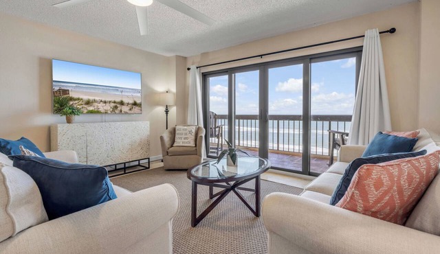 Direct oceanfront corner condo with big balcony, heated beachfront pool and garage parking