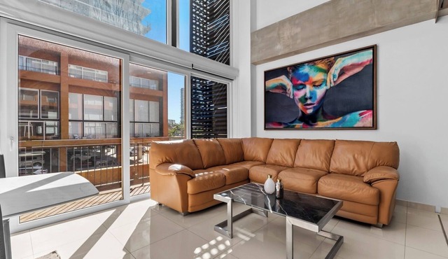 Double-height loft in Zoho Skies | Rooftop pool