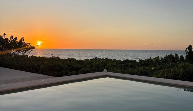 Enjoy the beach and the sunset in this beautiful beachfront home