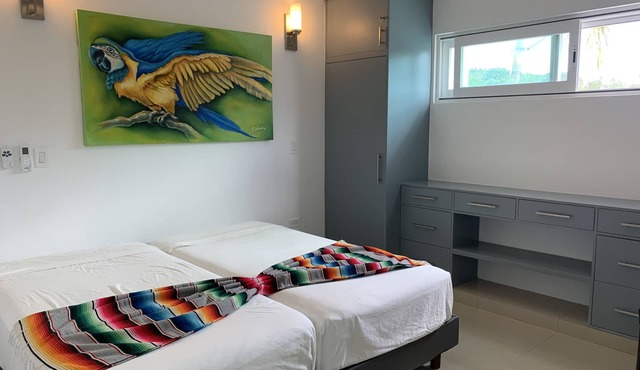 Family-sized private home walking distance to airport! 2 min (car) to the ocean.