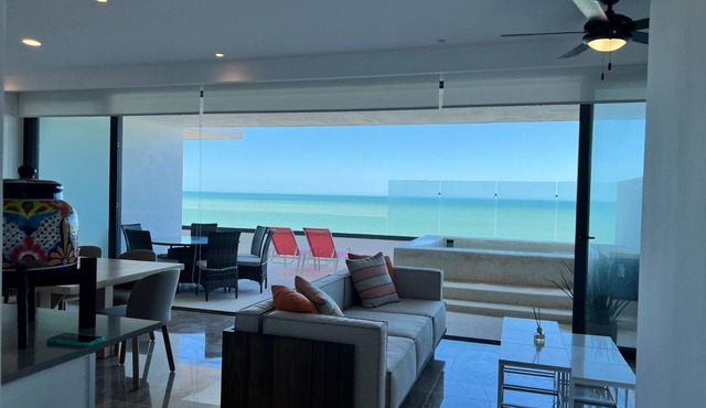 Luxury beachfront condo w/private jacuzzi