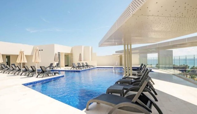 New condo in best building Playa, 1 block from beach, amazing rooftop pool