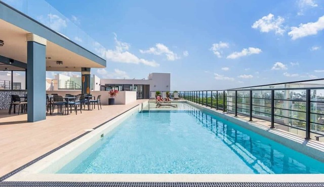 Partial Ocean View Condo w Rooftop Pool Near Beach