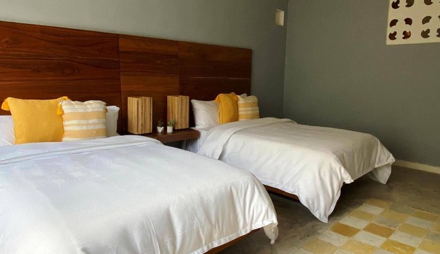 Preciosa habitación con 2 camas matrimoniales en el centro de Mérida.