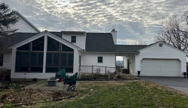 Quaint Cape Cod attached home nestled atop a hill near Speedwell Forge Lake
