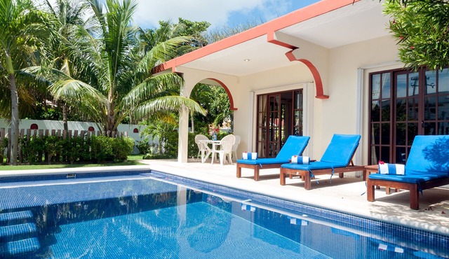 Relax by the sparkling pool and enjoy the ocean breeze.