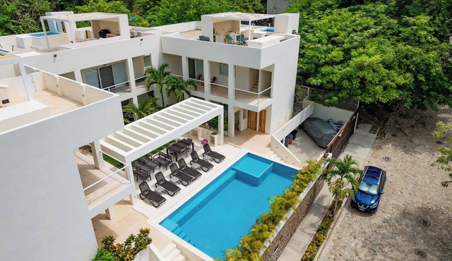 Rooftop Plunge Pool & Surf-Friendly Beach