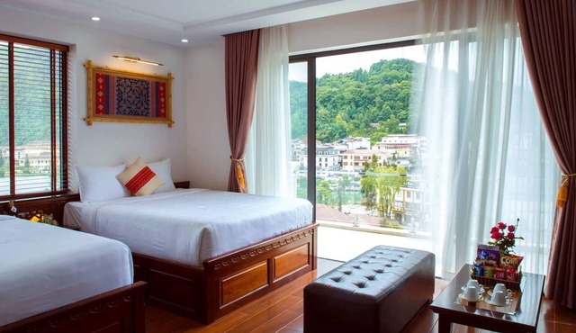 Spacious room with 2 queen beds and large balcony in Sapa Town