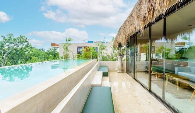 Stunning Tulum Condo: Rooftop Pool & Modern Design