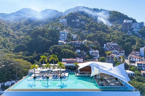 Sunset Getaway with Oceanfront Terrace and Resort Perks