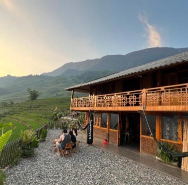 Traditional Hmong House Among Rice Fields