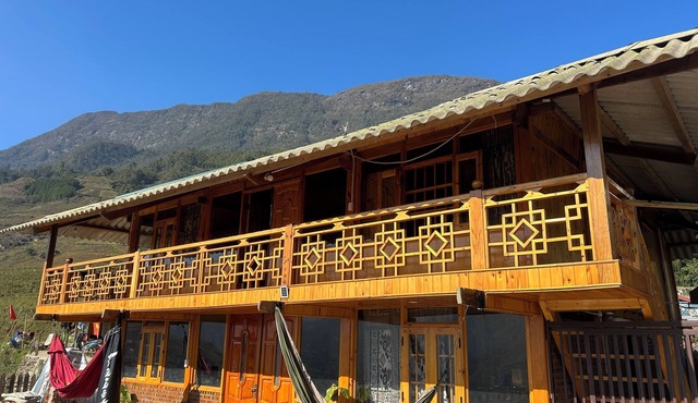 Traditional Hmong house in the heart of the rice fields